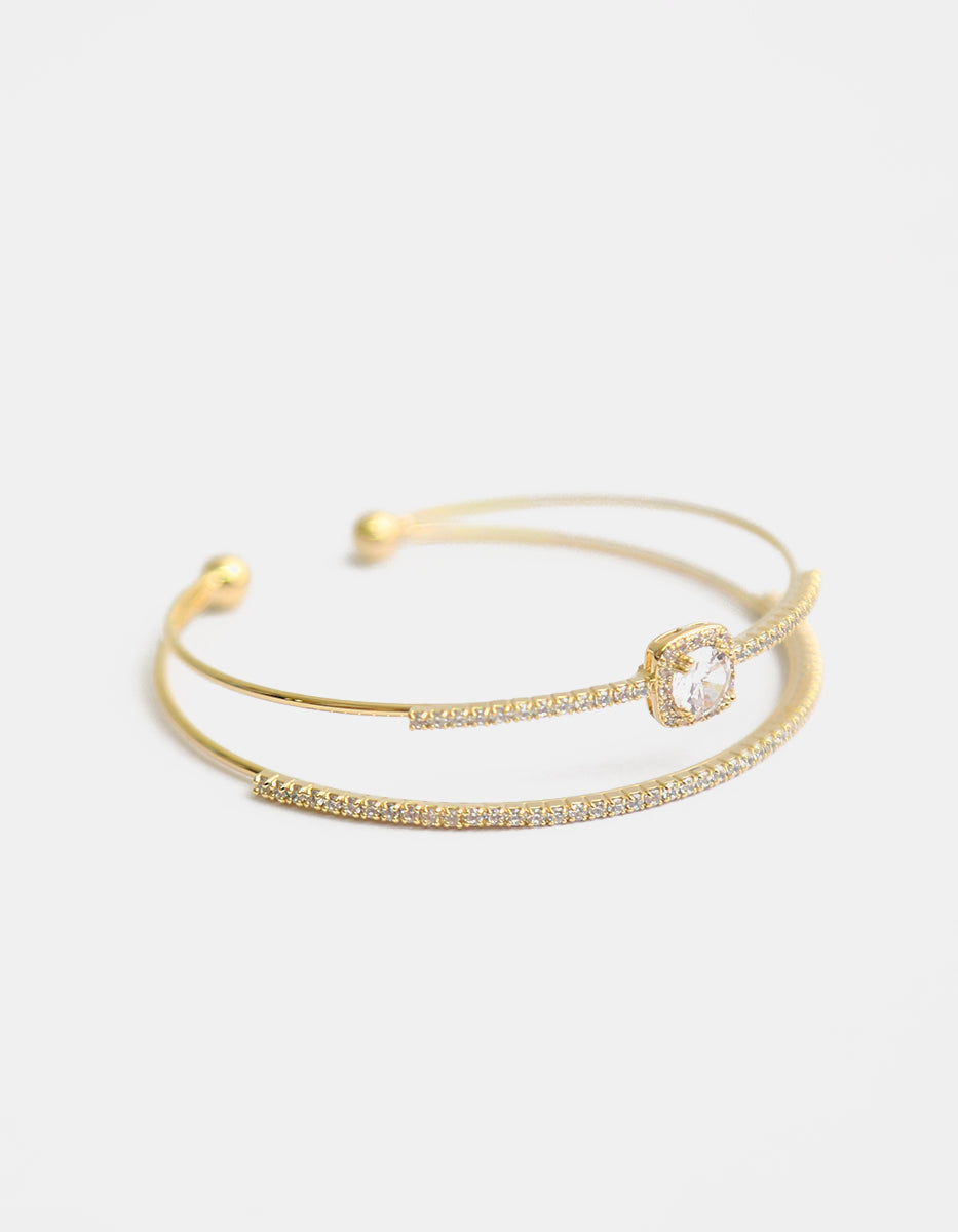 Brazalete con baño de oro 22 kt doble hilo con topacios blancos Festive Style